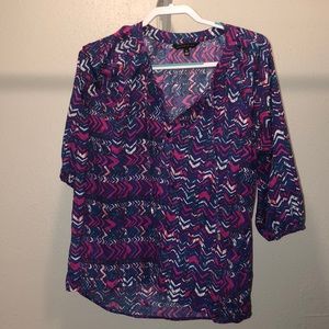 Small rainbow print shirt.